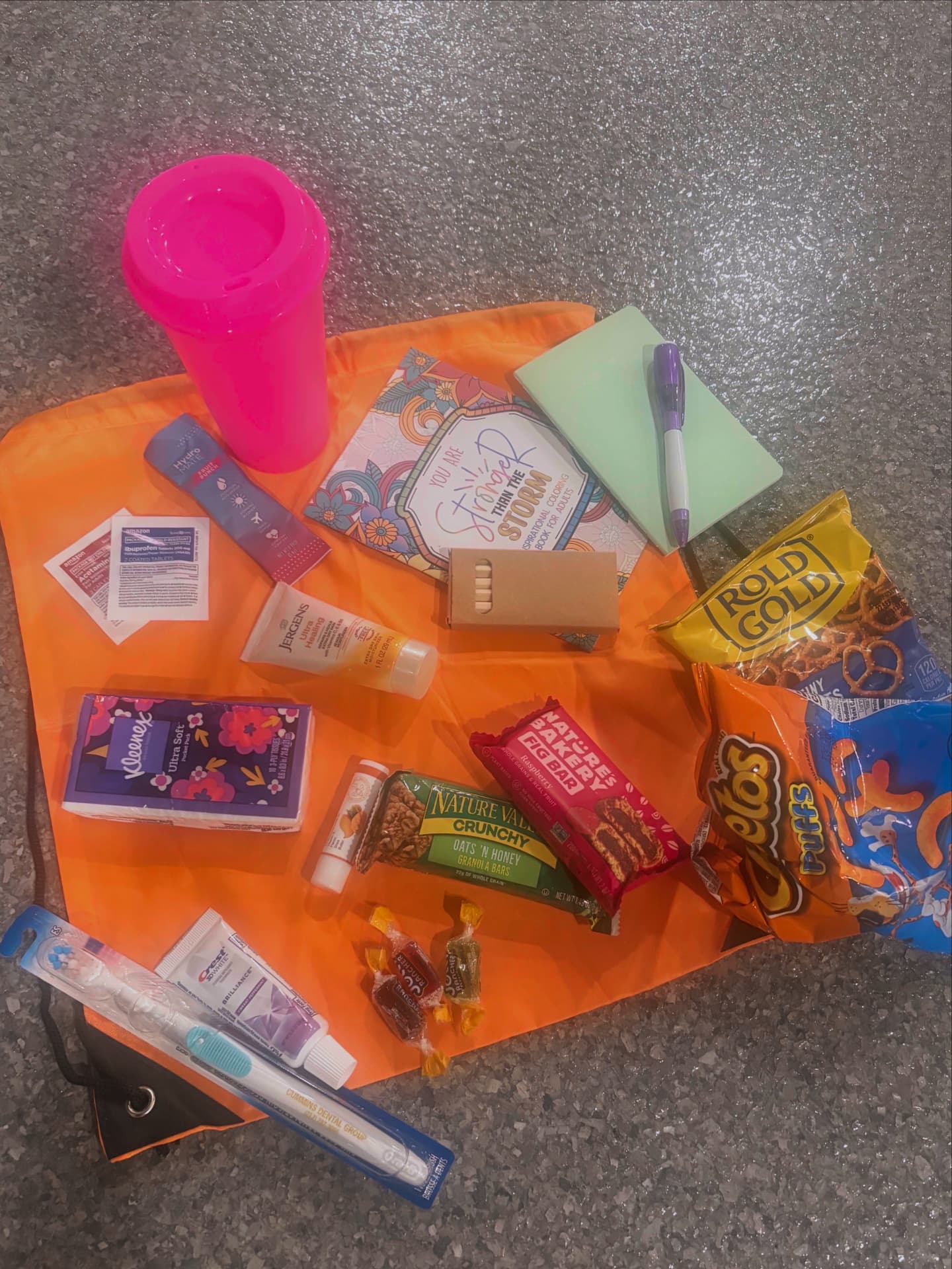 Comfort, hygiene, snack, and activity items included in a care package